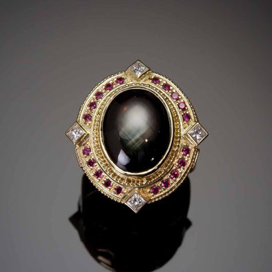 Black Star Sapphire Galaxy Ring in granulated 18K gold