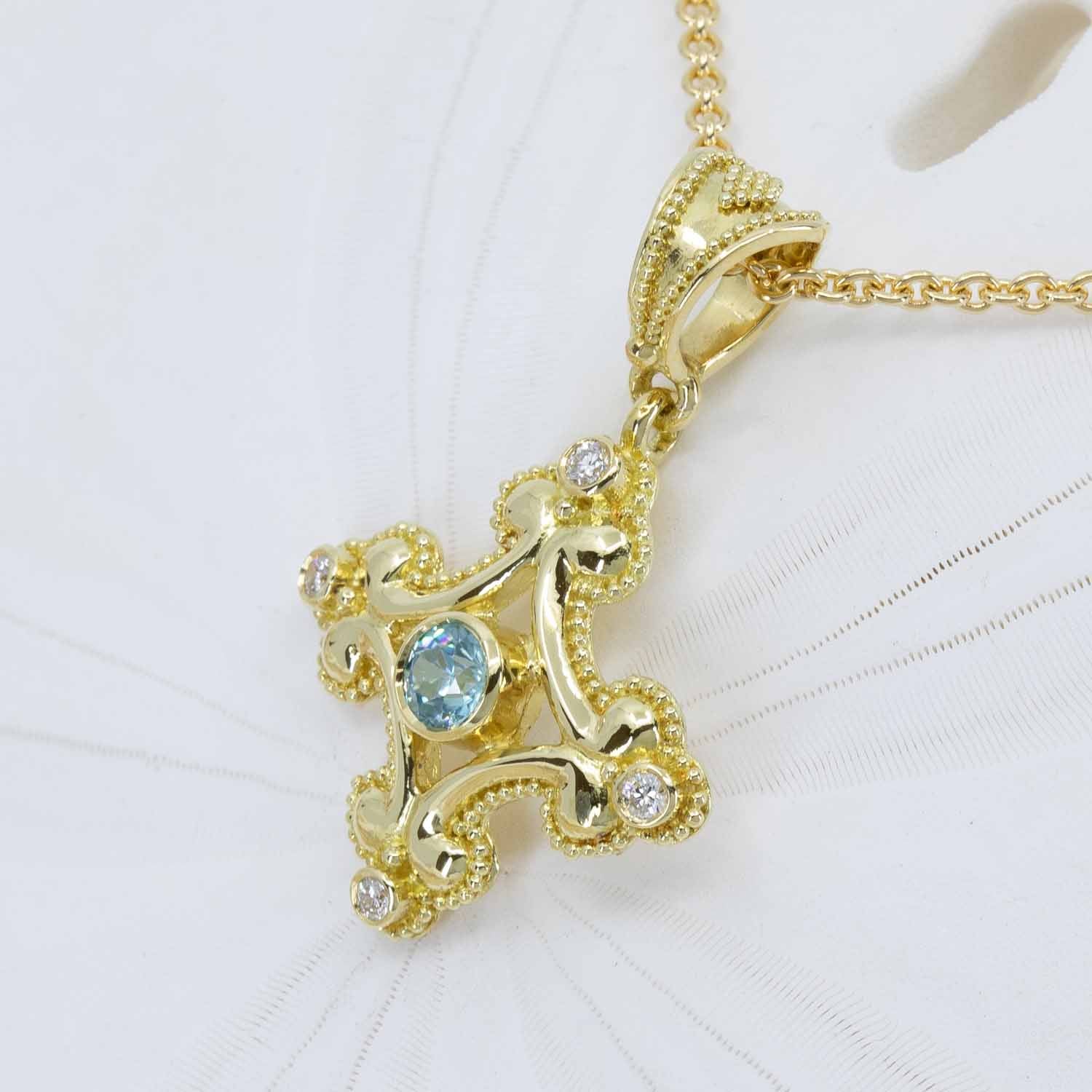 Blue zircon and pendant in 18K gold with gold granulation