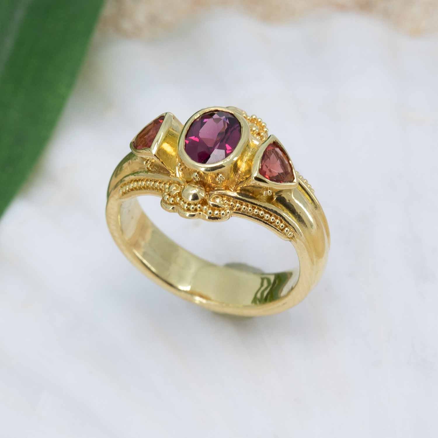 Garnet & Sunstone ring in granulated 18K gold