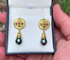 Ruby and Tahitian Black Pearl earrings in granulated 18K gold